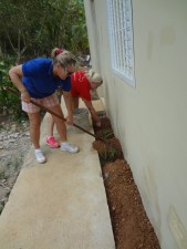 Dom Repub - Cathy & Angela cleaning and landscaping at clinic and school