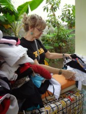 Dom Repub - Loretta sort clothes for fire victims